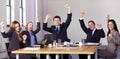 Victory gesture made by 5 business people