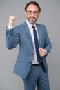 This is victory. middle-aged man with eyeglasses. looking smart and intelligent. man with beard and glasses feel success