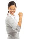 Victory is mine. Studio portrait of an attractive young woman doing a fist pump isolated on white.