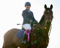 Victory is ours. an attractive young female jockey sitting on her horses back in the winners circle. Royalty Free Stock Photo