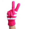 Victory Sign. Hand in knitted pink gloves isolated on white