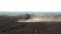 Video of big tractor with cultivator ploughs field