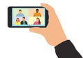 Video call with friends or colleagues at work. Hand of man holding smartphone, screen shows people. Virtual online communication,