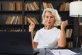 Video call. Happy middle aged senior woman sit with laptop talk on video call. Mature old senior lady having fun talking Royalty Free Stock Photo