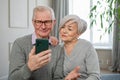 Video call. Happy senior couple woman man with smartphone having video call. Mature old grandmother grandfather talking Royalty Free Stock Photo