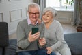 Video call. Happy senior couple woman man with smartphone having video call. Mature old grandmother grandfather talking Royalty Free Stock Photo