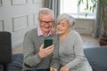 Video call. Happy senior couple woman man with smartphone having video call. Mature old grandmother grandfather talking Royalty Free Stock Photo