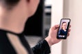 Video call with mobile phone. Man and woman talking in online cam chat and virtual meeting conference on internet. Smiling face. Royalty Free Stock Photo