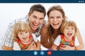 Video call screen of happy mom dad and twins daughters