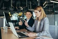 team of business people looking at camera and holding affirmative thumbs up gesture, coworkers asian man and woman Royalty Free Stock Photo