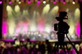 Video camera in background of concert, bokeh Royalty Free Stock Photo