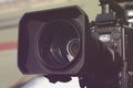 Video camera on the crane conducts shooting of a wedding in the hall of celebrations against the background. Royalty Free Stock Photo