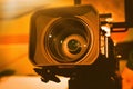 Video camera on the crane conducts shooting of a wedding in the hall of celebrations against the background.