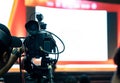 Video camera man recording live show digital broadcast of industry seminar event, professional production videographer Royalty Free Stock Photo