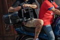 Video Camera Operator on a Motorcycle with a Camera while Filming a Sporting Event