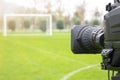 Video camera put on the back of football goal for broadcast on TV sport channel. football program can `t editing in studio