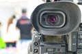Video camera that is recording a group of people Royalty Free Stock Photo