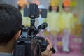 Video Camera recording kindergarder room with blurred background, copy space - Image . Video camera operator working with his Royalty Free Stock Photo