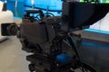 Television studio with camera and lights - recording TV show. Shallow depth of field Royalty Free Stock Photo