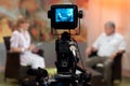 Shallow focus of a Video camera viewfinder, recording show in a TV studio during a talk show Royalty Free Stock Photo