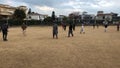 Kids playing footabll in the winter season with white grass in F11, Islamabad