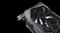 Video card with fan. Gaming graphics card for video games and cryptocurrency mining. Game video card isolated on black background Royalty Free Stock Photo