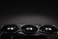 video card with three coolers from the computer on a dark background.concept computer harware. Royalty Free Stock Photo