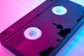 Video cassete on the color background. Retro vhs cassette tape