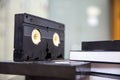 Video cassette tapes VHS in the video tape player and pile stack concept of old retro style or vintage electric and electronic Royalty Free Stock Photo