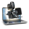 Video concept. Retro camera and laptop. Royalty Free Stock Photo