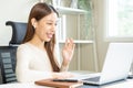 Video conference, happy attractive asian young woman, girl working, using laptop computer for online meeting in video call, Royalty Free Stock Photo