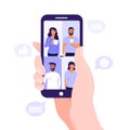 Video conference or online meeting concept. Hand holding a mobile phone. Team of people on smartphone screen having conversation. Royalty Free Stock Photo
