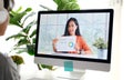 Video conference, Work from home, Asian woman holding business chart  while making video call to business team with virtual web, Royalty Free Stock Photo