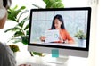 Video conference, Work from home, Asian woman holding business chart while making video call to business team with virtual web, Royalty Free Stock Photo