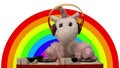 Toy unicorn djing with rainbow