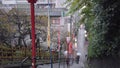 Video of elderlies holding umbrellas going down the steep stairs of Yushima Tenman-gÃÂ« Shrine.