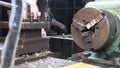 Video of a engineer working with metal details on a lathe