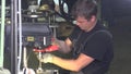 Video of a engineer working with metal drill on a lathe