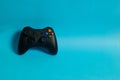 Video game console controller on a blue background Royalty Free Stock Photo