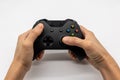 Video game console controller in gamer hands. Hand hold new joystick isolated on white Royalty Free Stock Photo