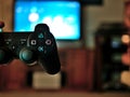 Video game console controller for gaming held in gamers hands. Royalty Free Stock Photo