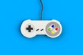 Video game console GamePad. Gaming concept. Top view retro joystick isolated on blue background