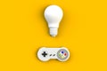 Video game console GamePad. Gaming concept. Top view retro joystick with light bulb isolated on yellow background