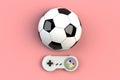 Video game console GamePad. Gaming concept. Top view retro joystick with soccer ball isolated on pink background Royalty Free Stock Photo