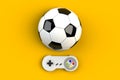Video game console GamePad. Gaming concept. Top view retro joystick with soccer ball isolated on yellow background Royalty Free Stock Photo