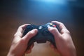 Video game controller in human hands, in front of the TV Royalty Free Stock Photo