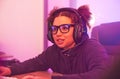 Video games, young girl and headset in home for esports, online rpg and virtual competition. Female gamer, computer