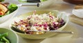 Video of healthy appetising meal with cheese, fruits, salad, vegetables and chicken on dinner table