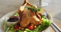 Video of healthy appetising meal with roast chicken, sauce and salad on wooden dinner table