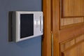 Video intercom display near the entrance door at home close up